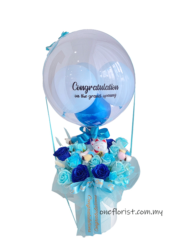 Table flower arrangement with balloon blue